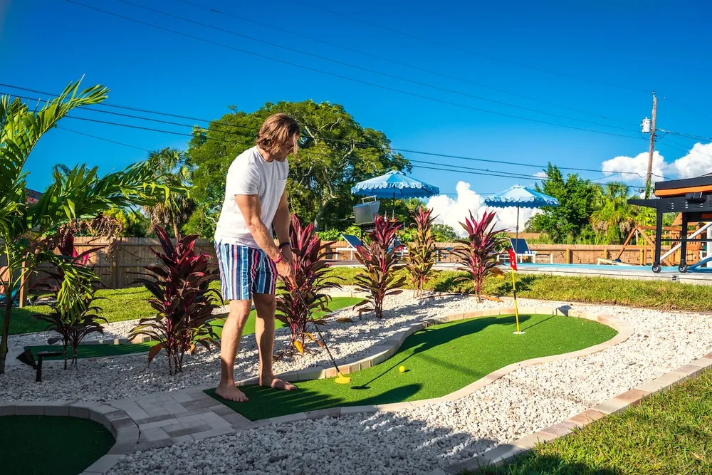 Playing mini golf in the backyard
