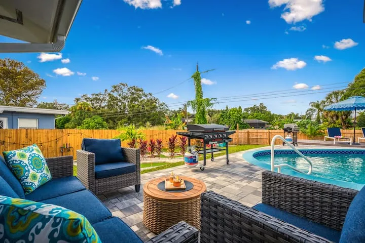 Outdoor lounge area overlooking pool