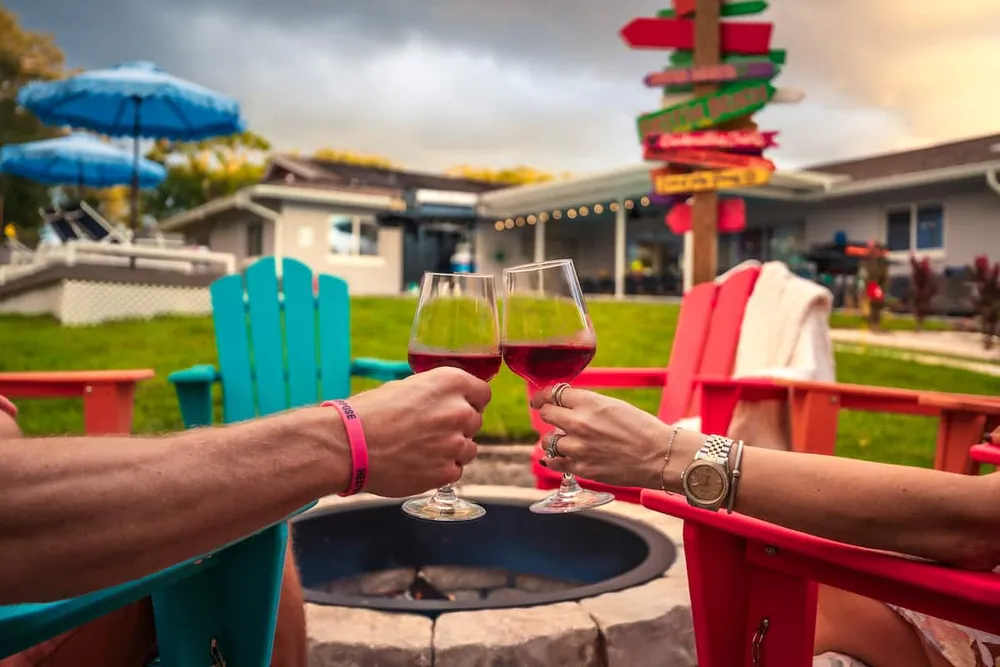 Cheers with wine at the fire pit