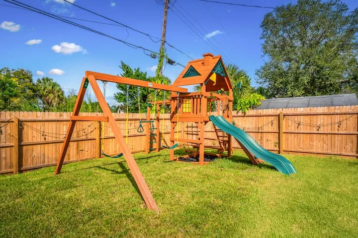 Swing set and climbing wall