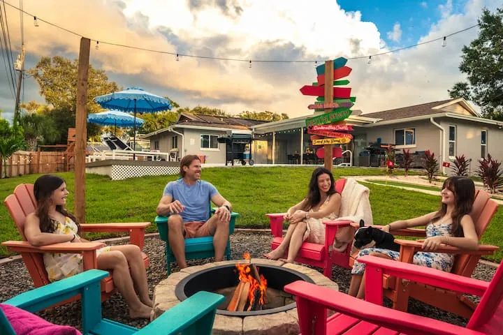 Family gathered around fire pit