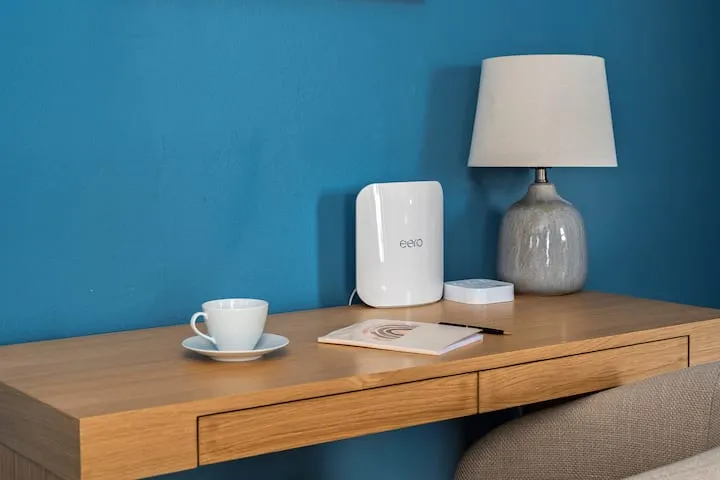 Desk with Eero wifi and coffee cup