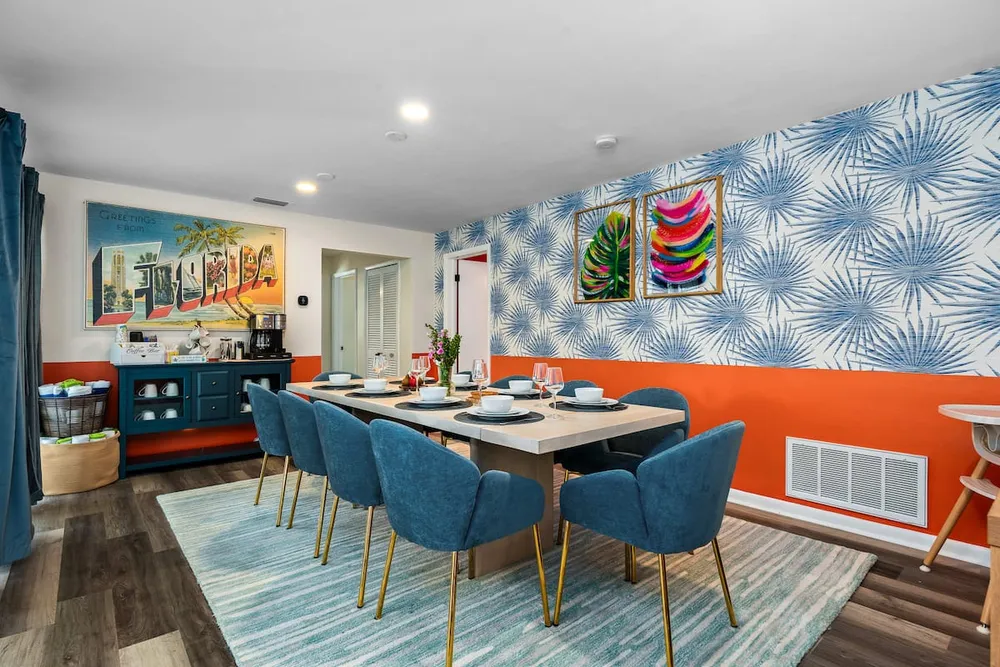 Tropical dining room with palm wallpaper