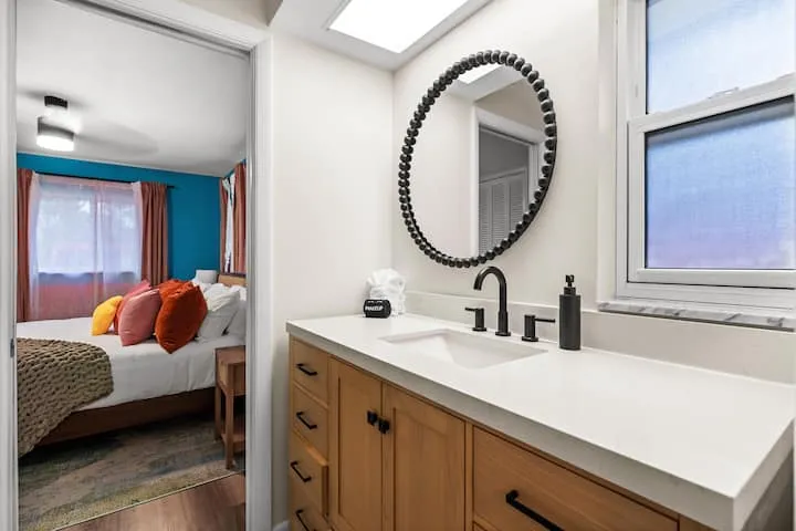 Bathroom 1 vanity with beaded round mirror