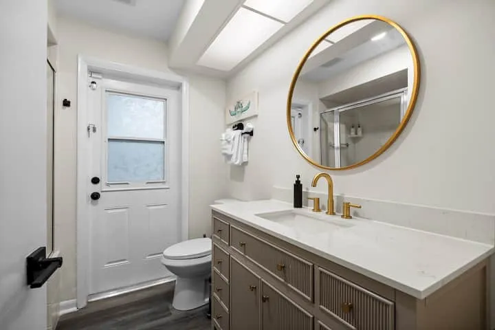 Bathroom 2 vanity with gold fixtures