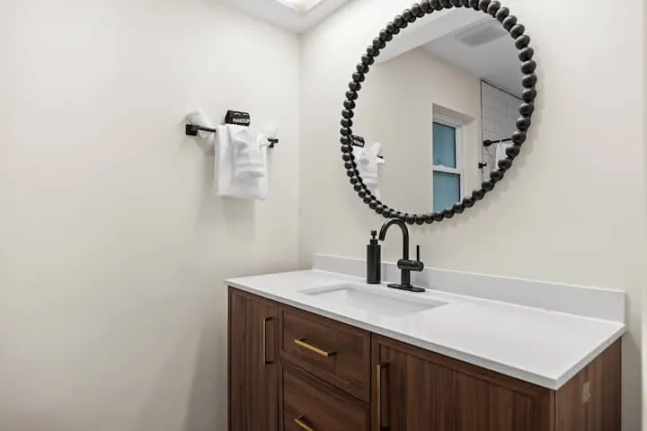 Bathroom 3 walnut vanity with beaded mirror