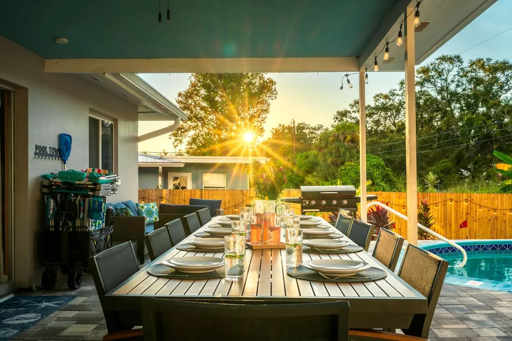 Covered patio dining table at sunset