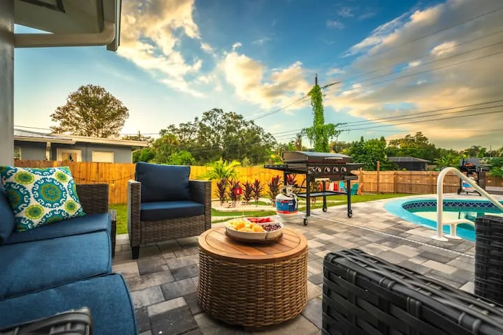 Patio seating with fruit platter and pool view