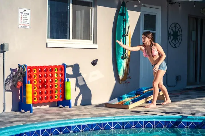 Giant Connect Four and cornhole by the pool